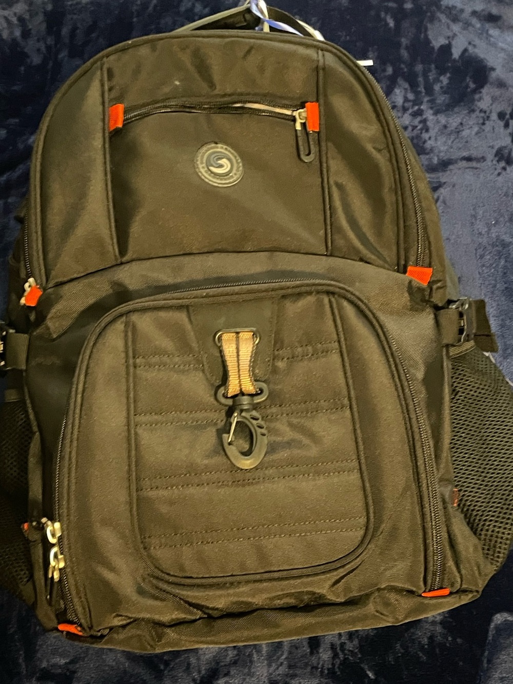 Black hiking Backpack with plenty of storage and combination lock